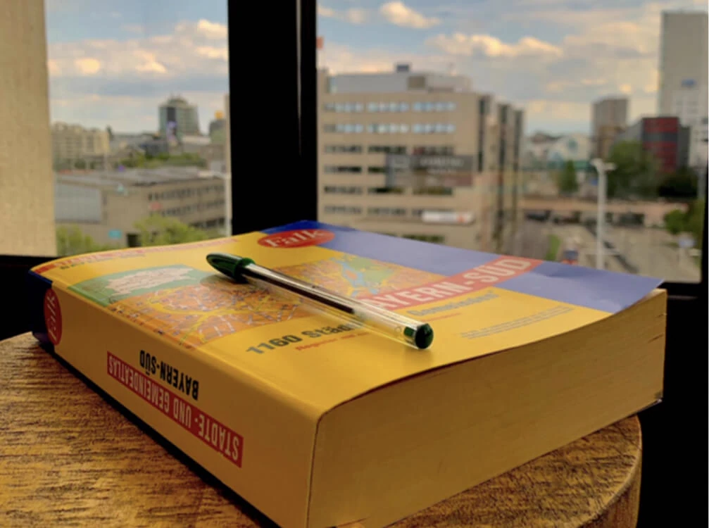 Mapcreator's history, thick book of paper maps